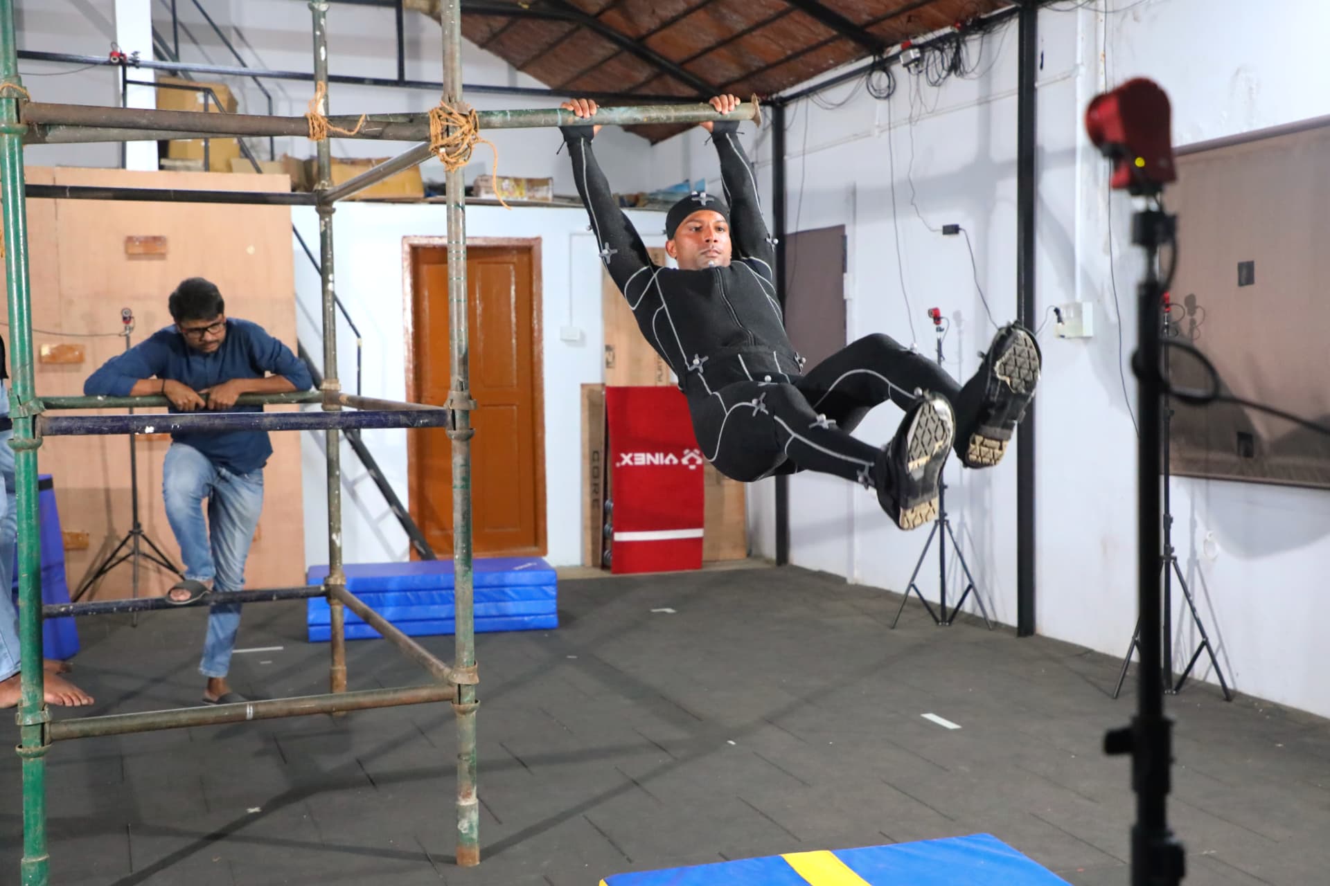 Actor hanging from a rig during body capture