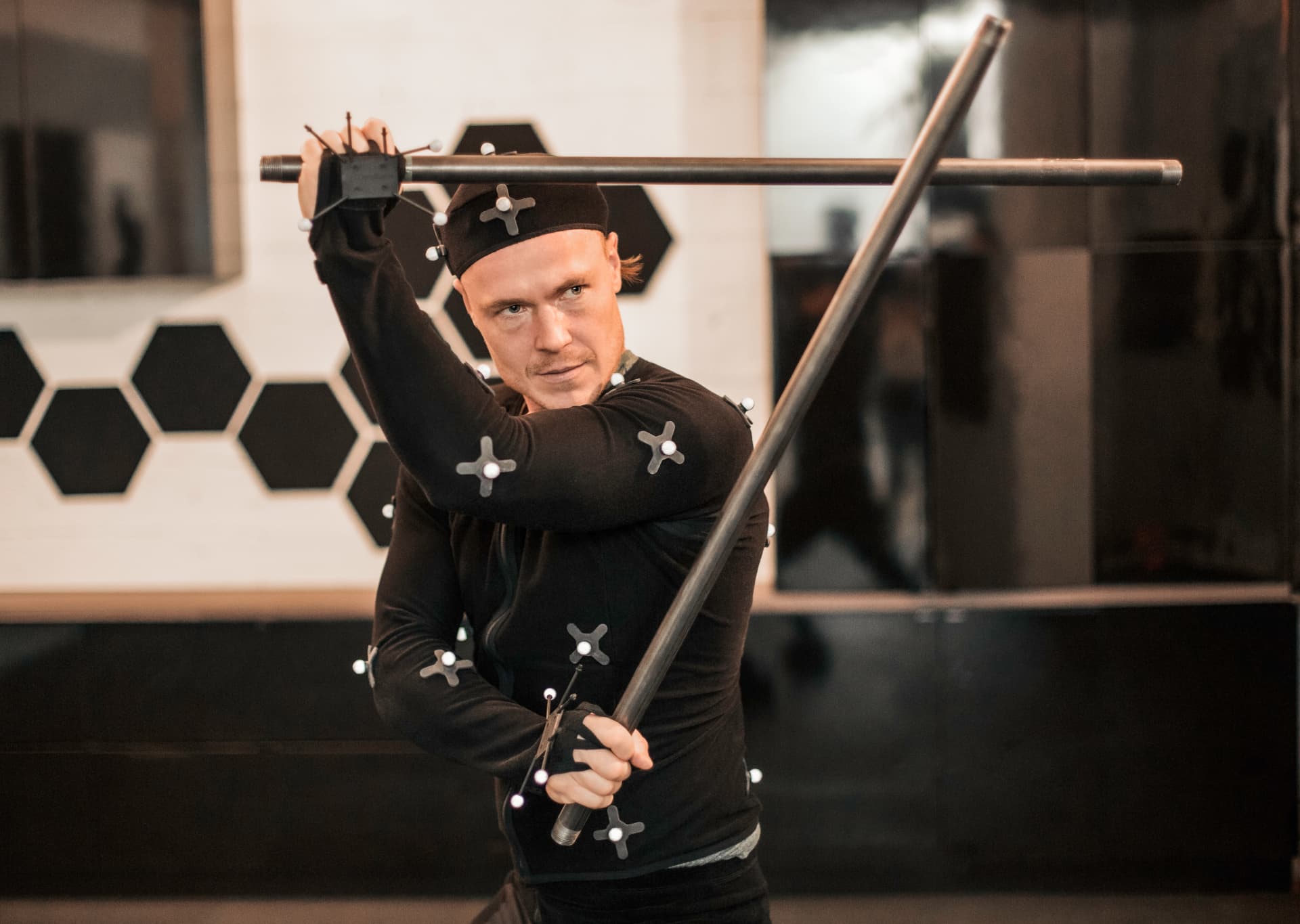 Actor with a prop pole staff during a capture session